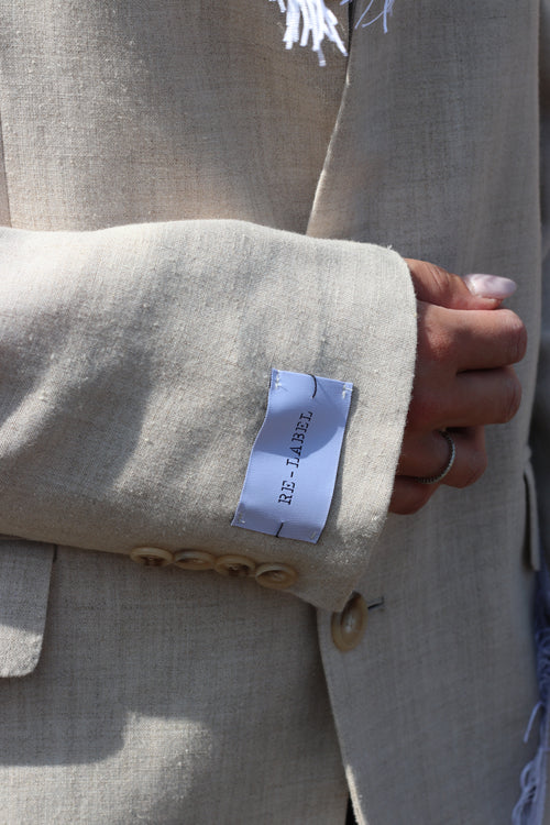 Beige blazer with fringe detail