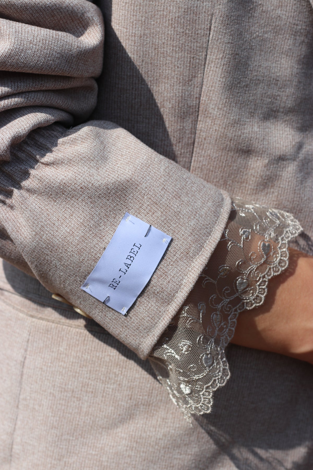 Beige blazer with lace details